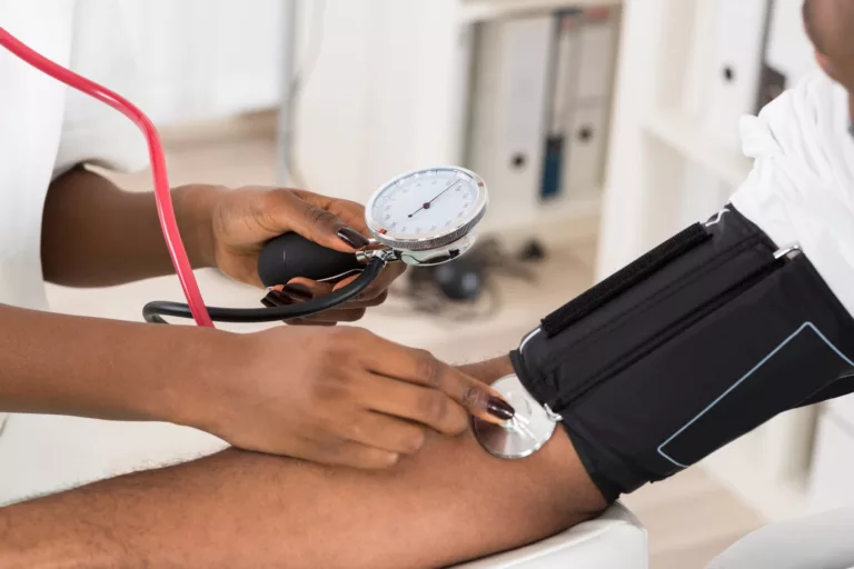 a man having his blood pressure checked